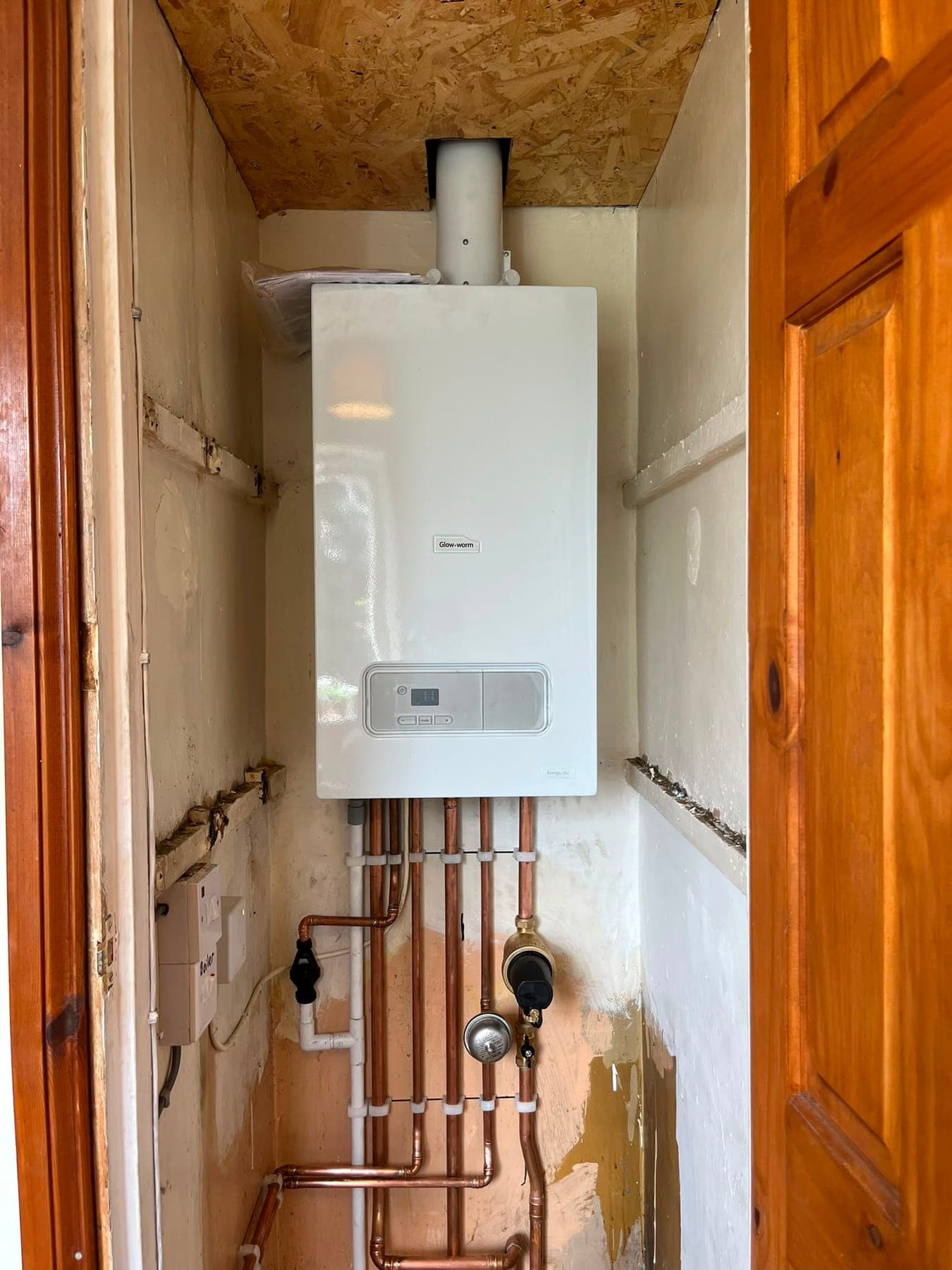Newly installed Glow-worm combi boiler with neat copper pipework