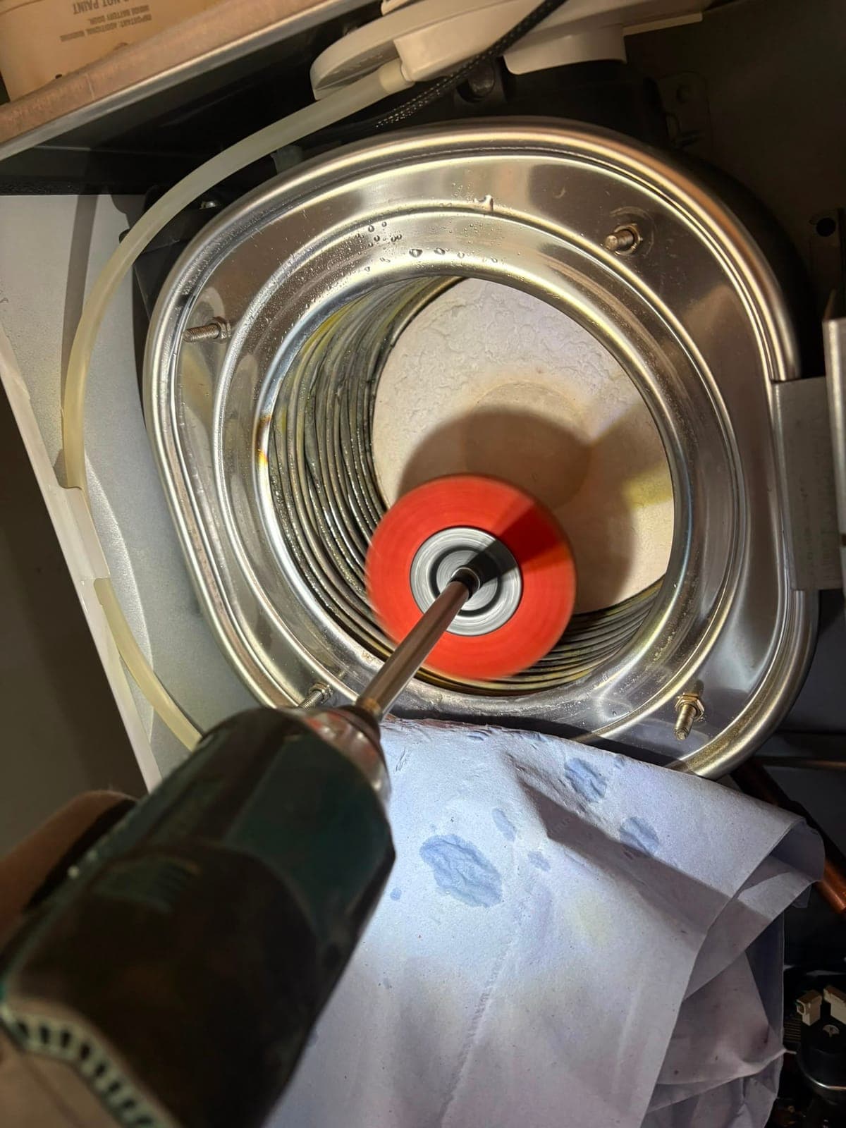 Boiler heat exchanger being cleaned during a service